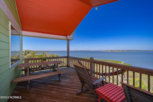 deck featuring a water view