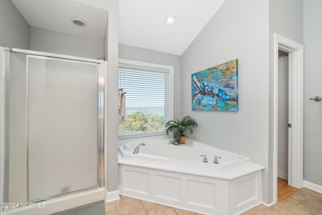 bathroom with tile patterned floors, plus walk in shower, and vaulted ceiling