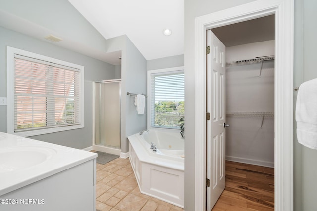 bathroom with vanity, tile patterned floors, plus walk in shower, and a healthy amount of sunlight