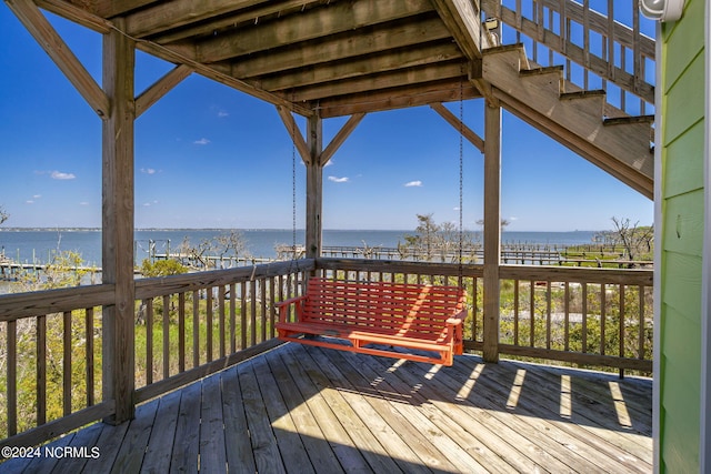 wooden terrace with a water view