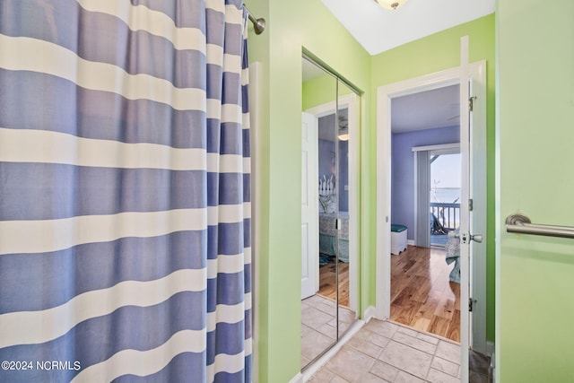 bathroom featuring a shower with curtain and hardwood / wood-style floors