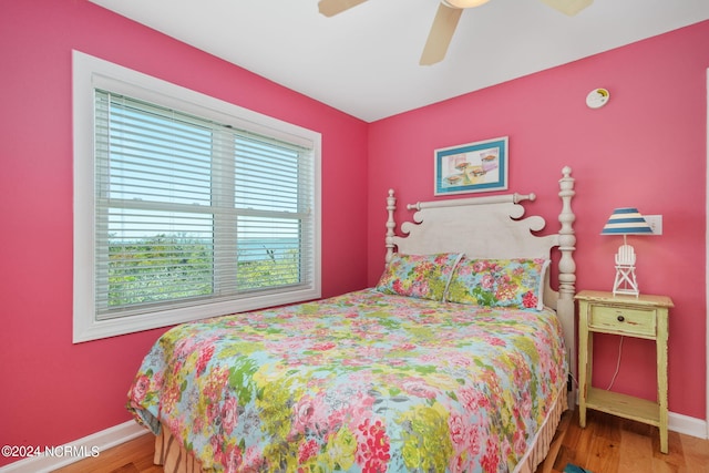 bedroom featuring ceiling fan and hardwood / wood-style floors