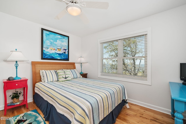 bedroom with hardwood / wood-style flooring and ceiling fan