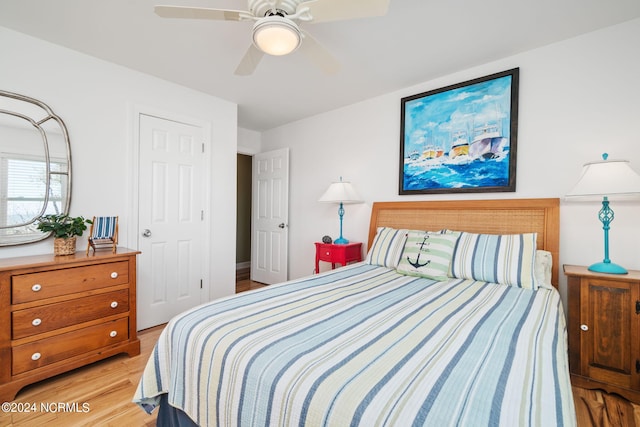 bedroom with ceiling fan and light wood-type flooring