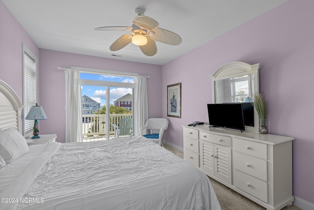 bedroom with ceiling fan, access to exterior, and light colored carpet