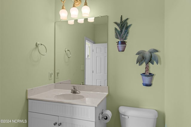 bathroom featuring toilet and oversized vanity