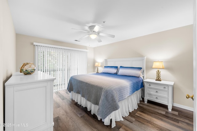 bedroom with ceiling fan and dark hardwood / wood-style flooring