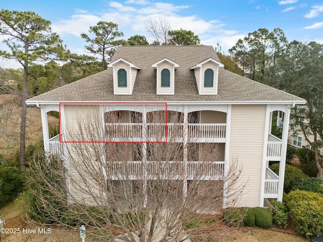 view of home's exterior with a balcony