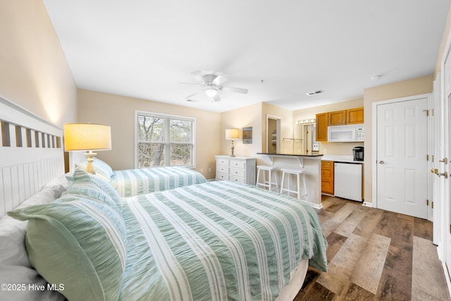 bedroom featuring ceiling fan and light hardwood / wood-style flooring