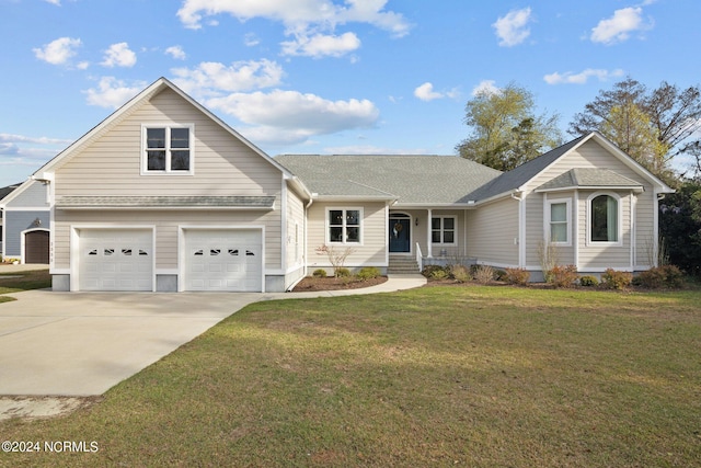 view of front of property with a front lawn and a garage