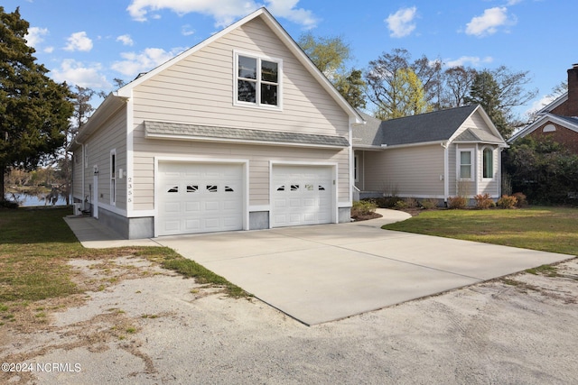 view of front facade with a garage and a front lawn