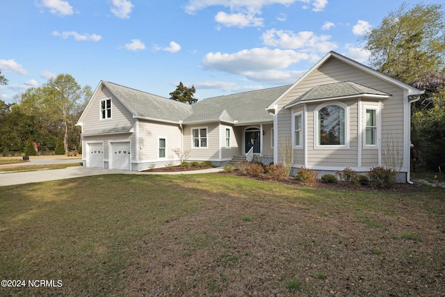 view of front of home with a garage and a front yard