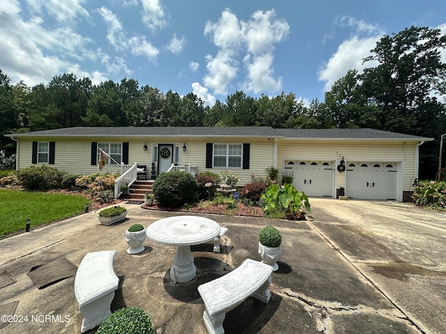 single story home featuring a garage