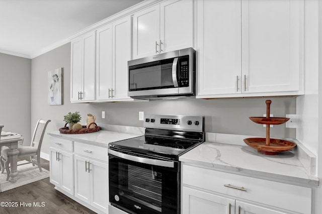 kitchen with stainless steel appliances, crown molding, light stone countertops, dark hardwood / wood-style flooring, and white cabinetry