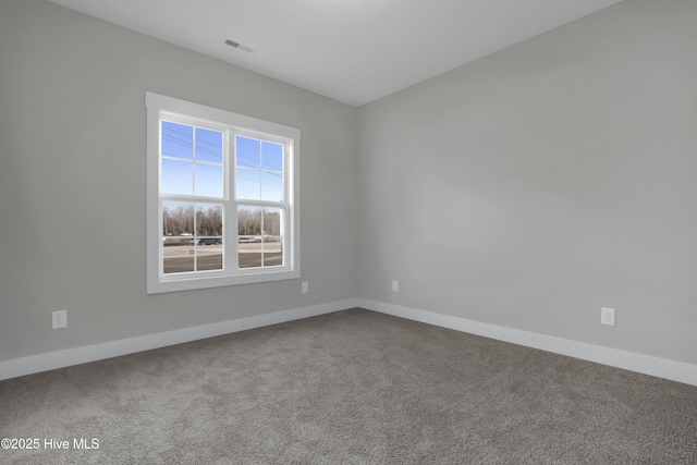 unfurnished room featuring carpet