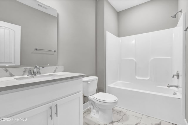 full bathroom featuring bathing tub / shower combination, vanity, and toilet