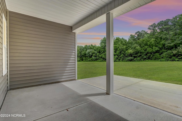 patio terrace at dusk with a yard