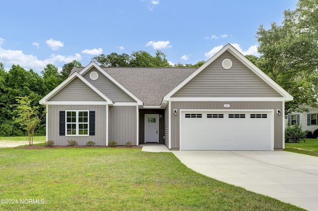 ranch-style house with a front lawn and a garage