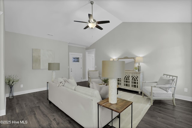 living room with lofted ceiling, ceiling fan, and dark hardwood / wood-style floors