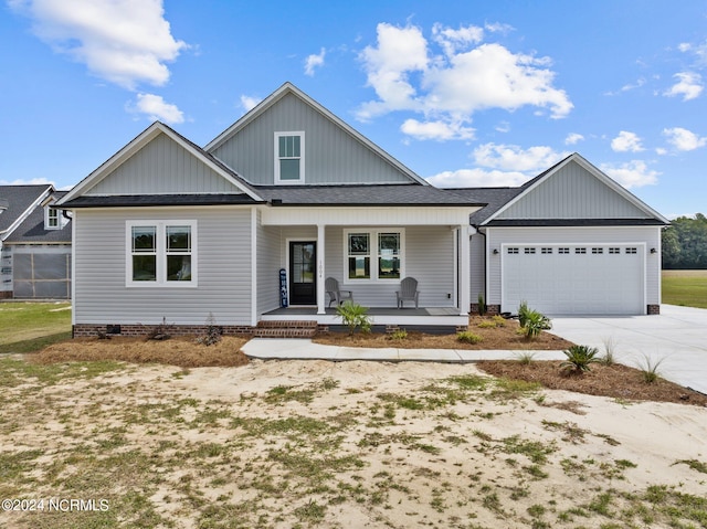 view of front facade featuring a porch and a garage