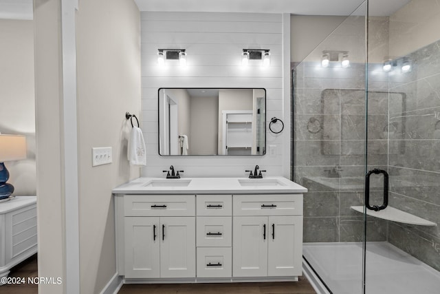 bathroom with vanity and an enclosed shower