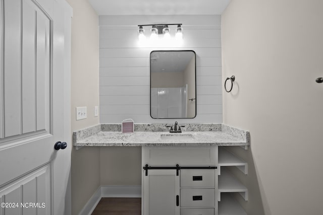 bathroom featuring hardwood / wood-style floors and vanity