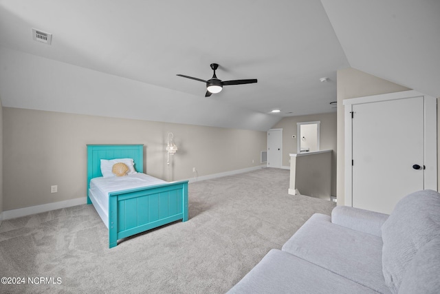 bedroom featuring ceiling fan, light colored carpet, and lofted ceiling