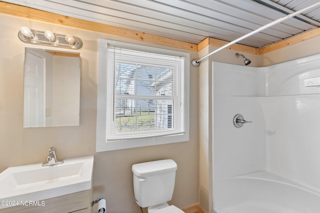 full bathroom featuring toilet, vanity, and bathing tub / shower combination