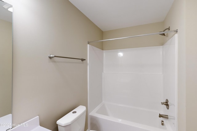 bathroom with shower / bathtub combination and toilet