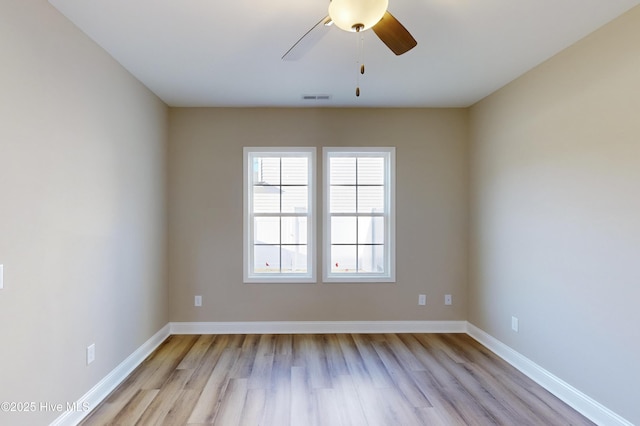 spare room with ceiling fan and light hardwood / wood-style floors