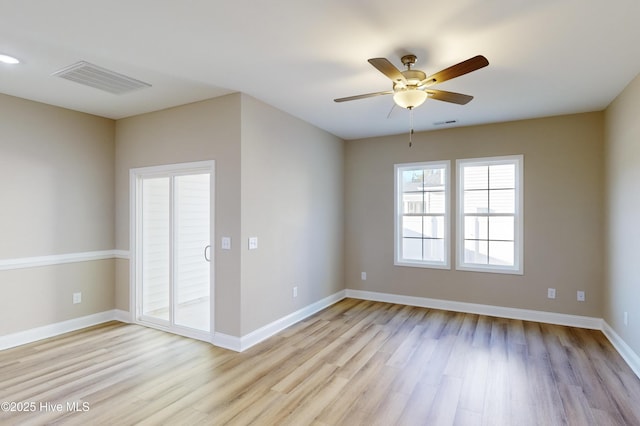 spare room featuring light hardwood / wood-style floors and ceiling fan