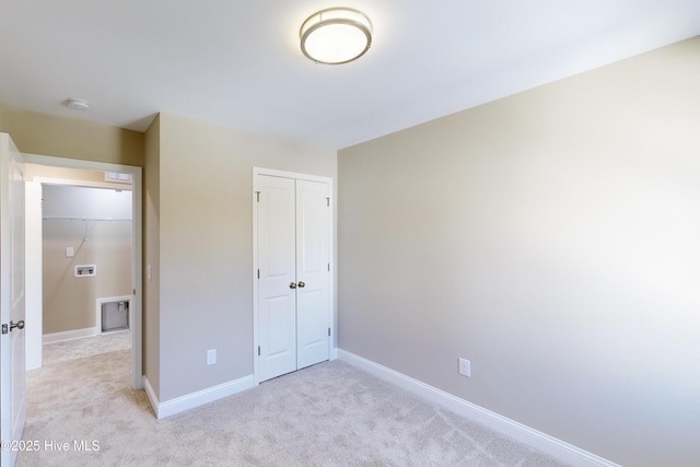 unfurnished bedroom with light carpet