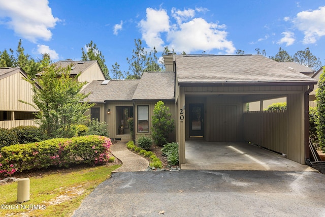 view of front of home with a carport