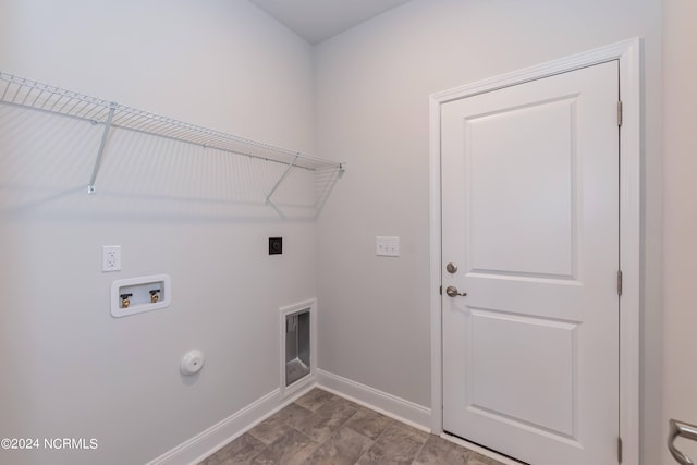 clothes washing area featuring washer hookup, hookup for an electric dryer, and hookup for a gas dryer