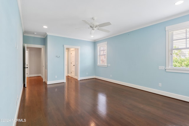 interior space featuring ornamental molding, ceiling fan, a wealth of natural light, and dark wood-type flooring