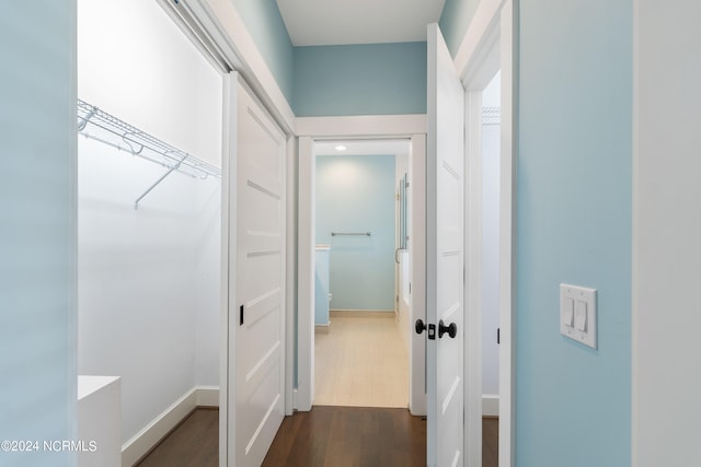 hall with dark wood-type flooring