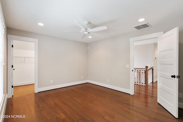 unfurnished room featuring dark hardwood / wood-style floors and ceiling fan