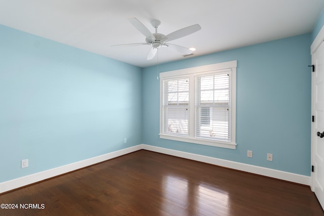 empty room with hardwood / wood-style flooring and ceiling fan