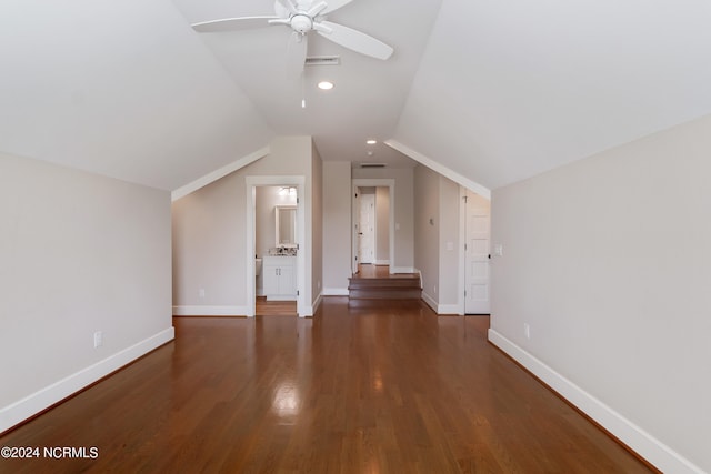 bonus room with lofted ceiling, dark hardwood / wood-style floors, and ceiling fan