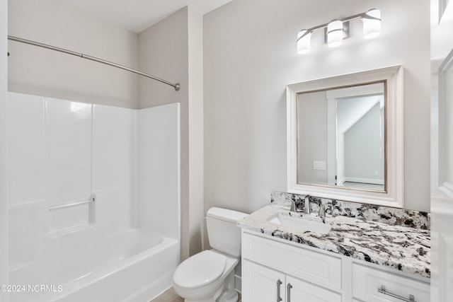 full bathroom featuring shower / bathing tub combination, vanity, and toilet