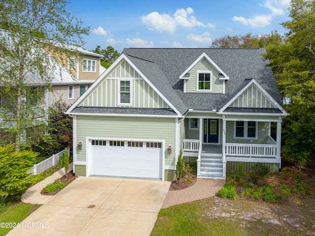 view of front of property with a garage and covered porch