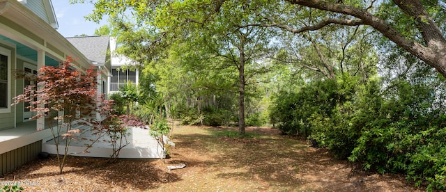 view of yard featuring a sunroom