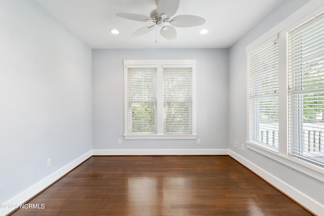 unfurnished room featuring dark hardwood / wood-style floors and ceiling fan