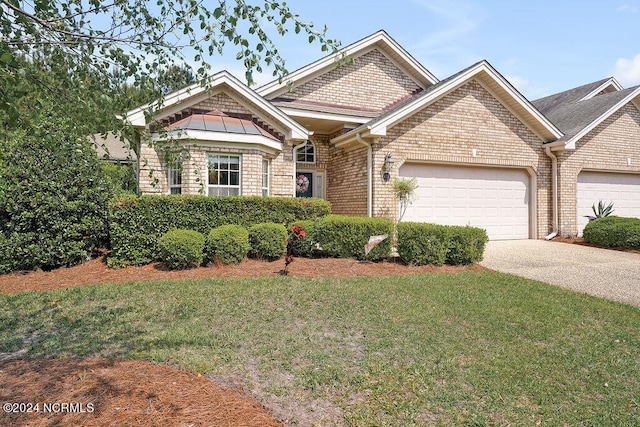 view of front facade featuring a garage and a front lawn