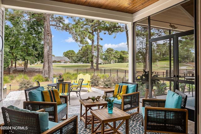 sunroom featuring wooden ceiling