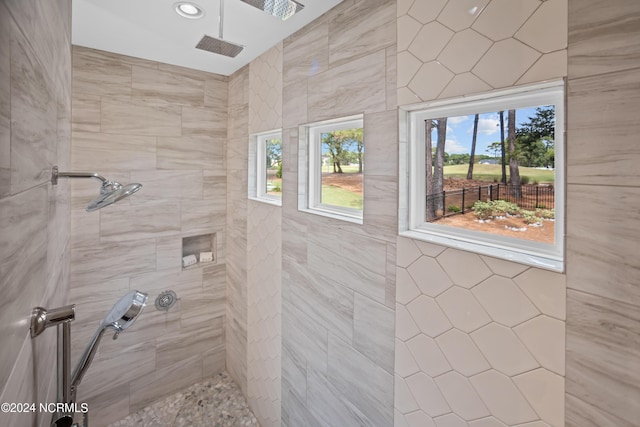 bathroom with tiled shower