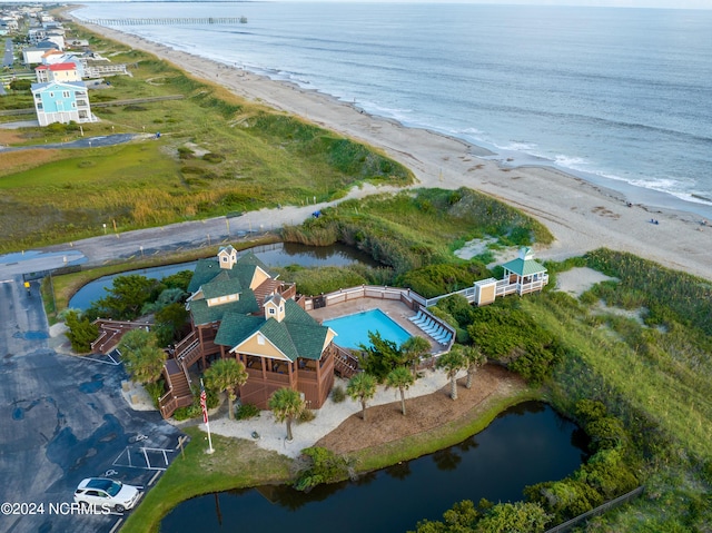 drone / aerial view with a water view and a view of the beach