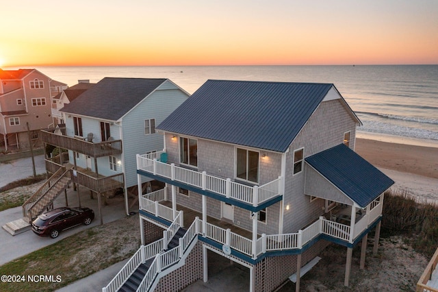 aerial view at dusk with a water view