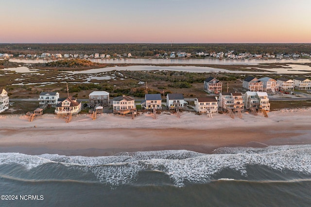 aerial view at dusk with a water view