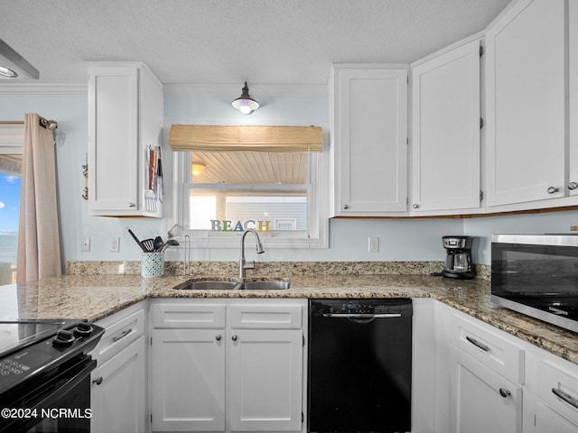 kitchen with sink, light stone countertops, a textured ceiling, white cabinetry, and black appliances